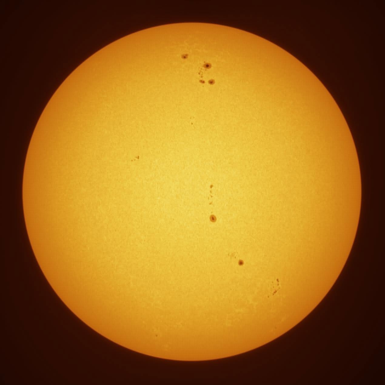 The Sun with several visible sunspot groups photographed by Jeremiah Smith